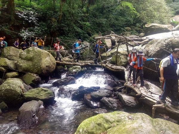 Hikers crossing the river